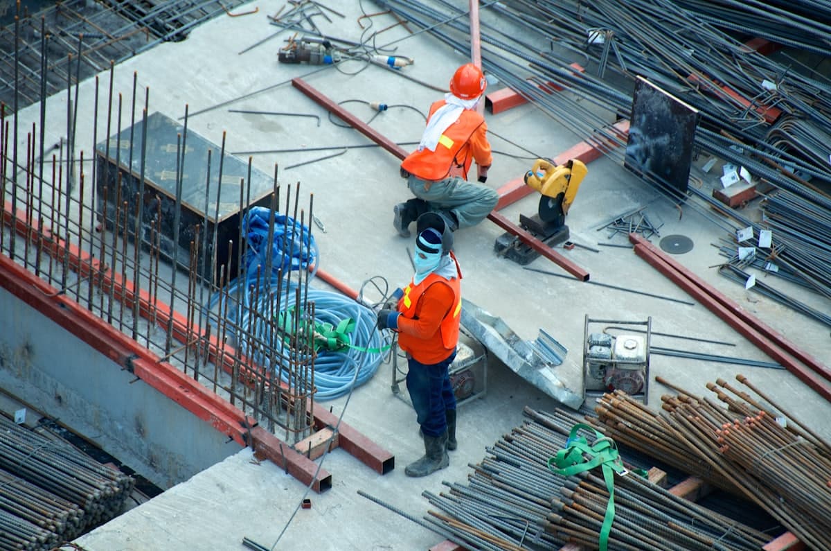 Construction professionals reviewing plans on site